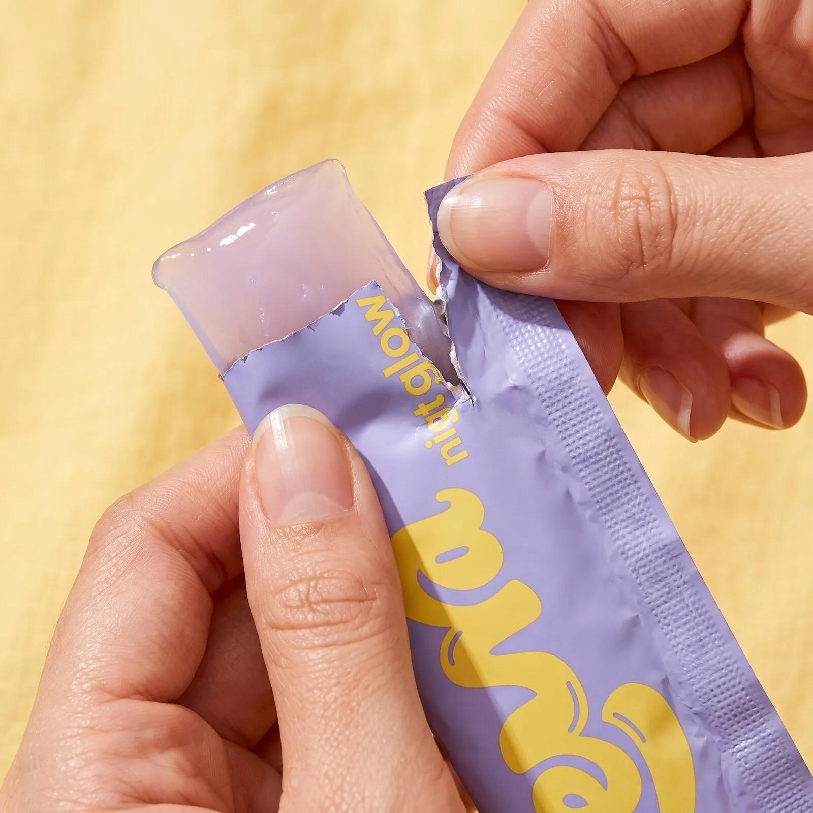 Tearing open a Night Glow jelly stick